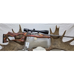 U93R1717HMR Pre-Owned Savage 93R17 BSEV 17 HMR Spiral Fluted Heavy Barrel, Red Laminated Stock with Bushnell 7-21x40 scope and  2 x 5rnd mags. 150 rounds through. Condition Good-Very Good
